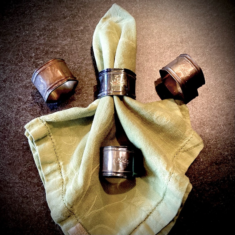 Set of Four Silver Napkin Rings Set with Crown Motif